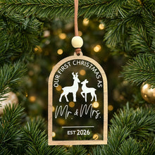 Load image into Gallery viewer, Our First Christmas as Mr. & Mrs. 2026 clear acrylic ornament on a Christmas tree, with the tree showing through