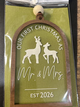 Load image into Gallery viewer, Our First Christmas as Mr. &amp; Mrs. ornament in its clear hanging pack with a green card behind it
